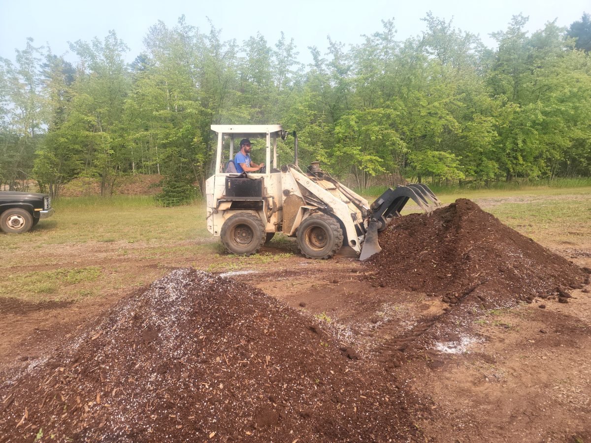 Mixing some soil for potting.